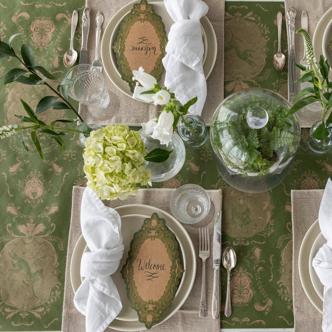 The Moss Fable Toile Runner under an elegant table setting, from above.