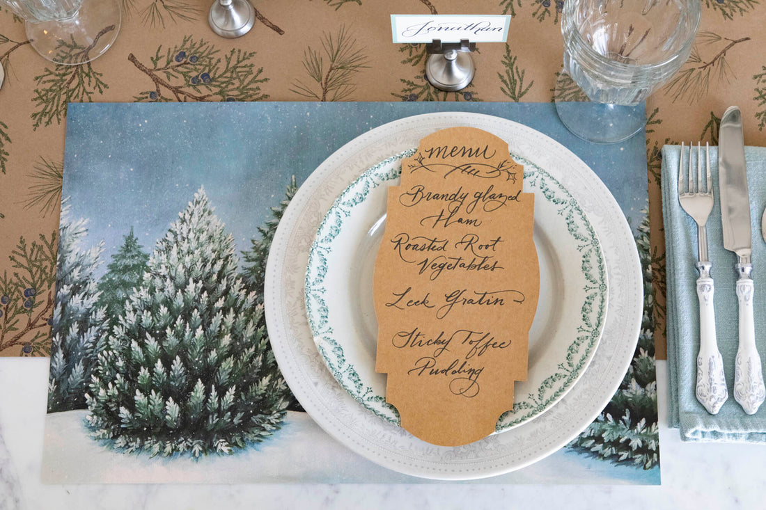 Delicately frosted trees on a Evergreen Forest Placemat by Hester &amp; Cook.