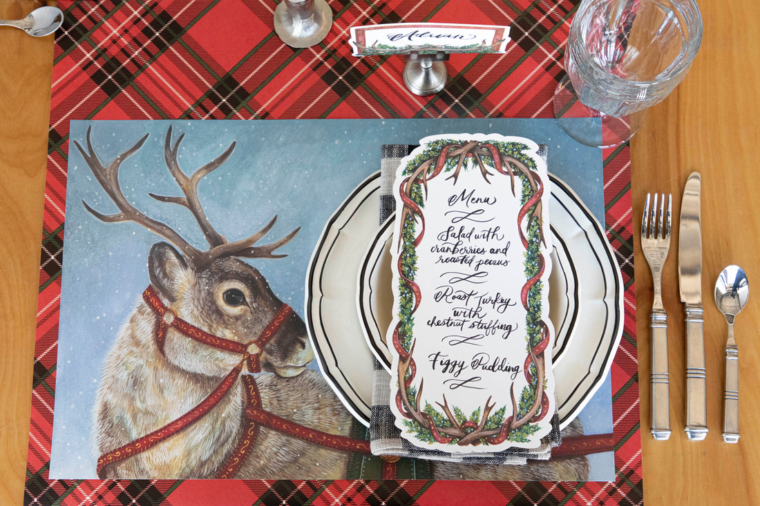 Table setting with Dashing Reindeer Placemat and Red Plaid Table Runner 