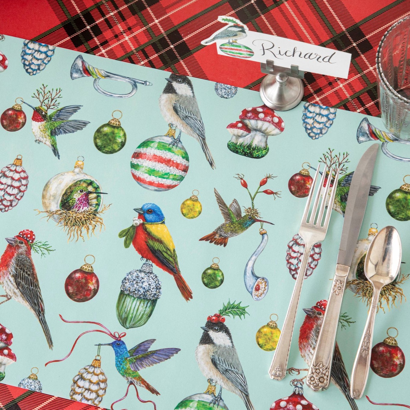 The Baubles and Birds Placemat on the Red Plaid Runner.