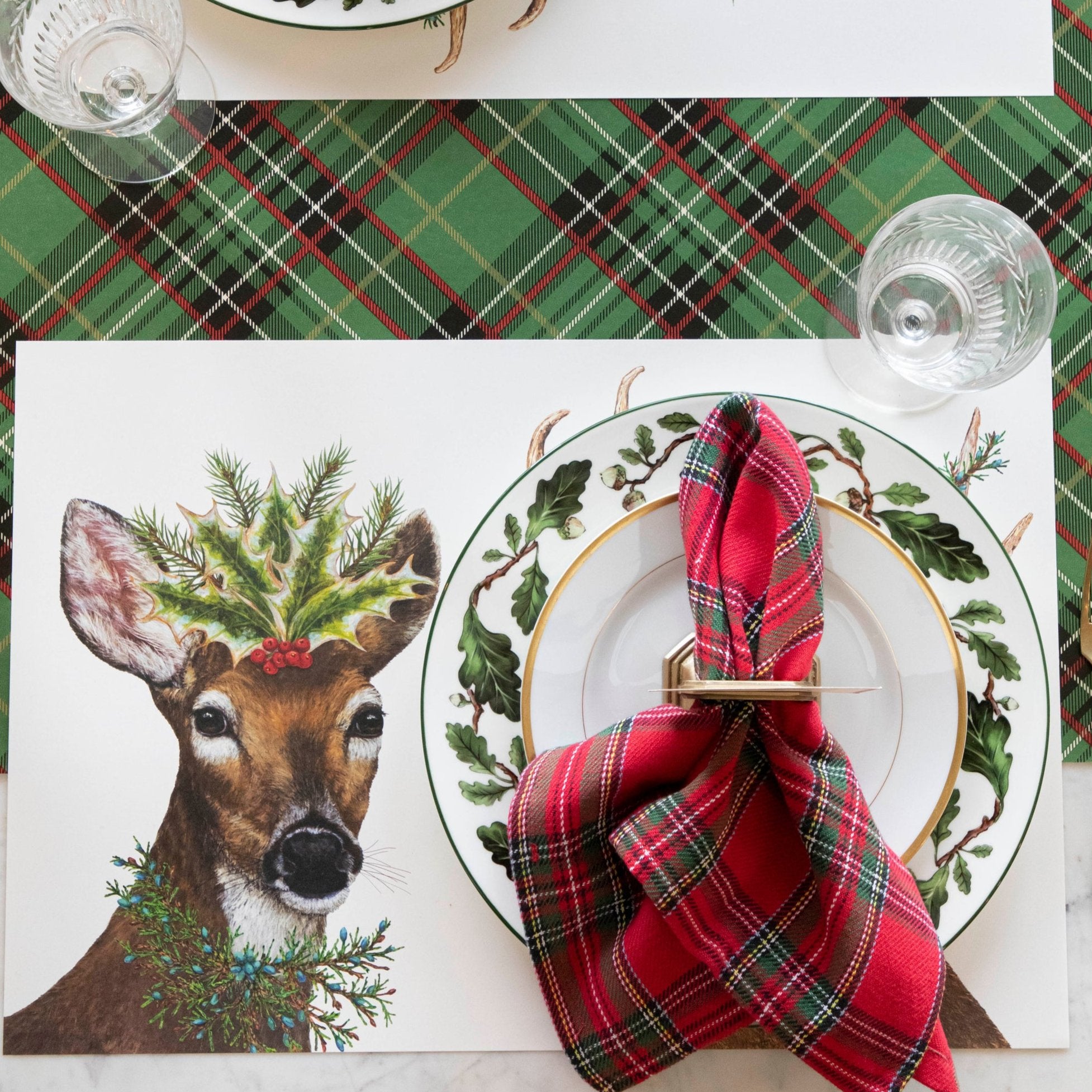 An elegant, festive table setting featuring the Deer to Me Placemat on the Green Plaid Runner.