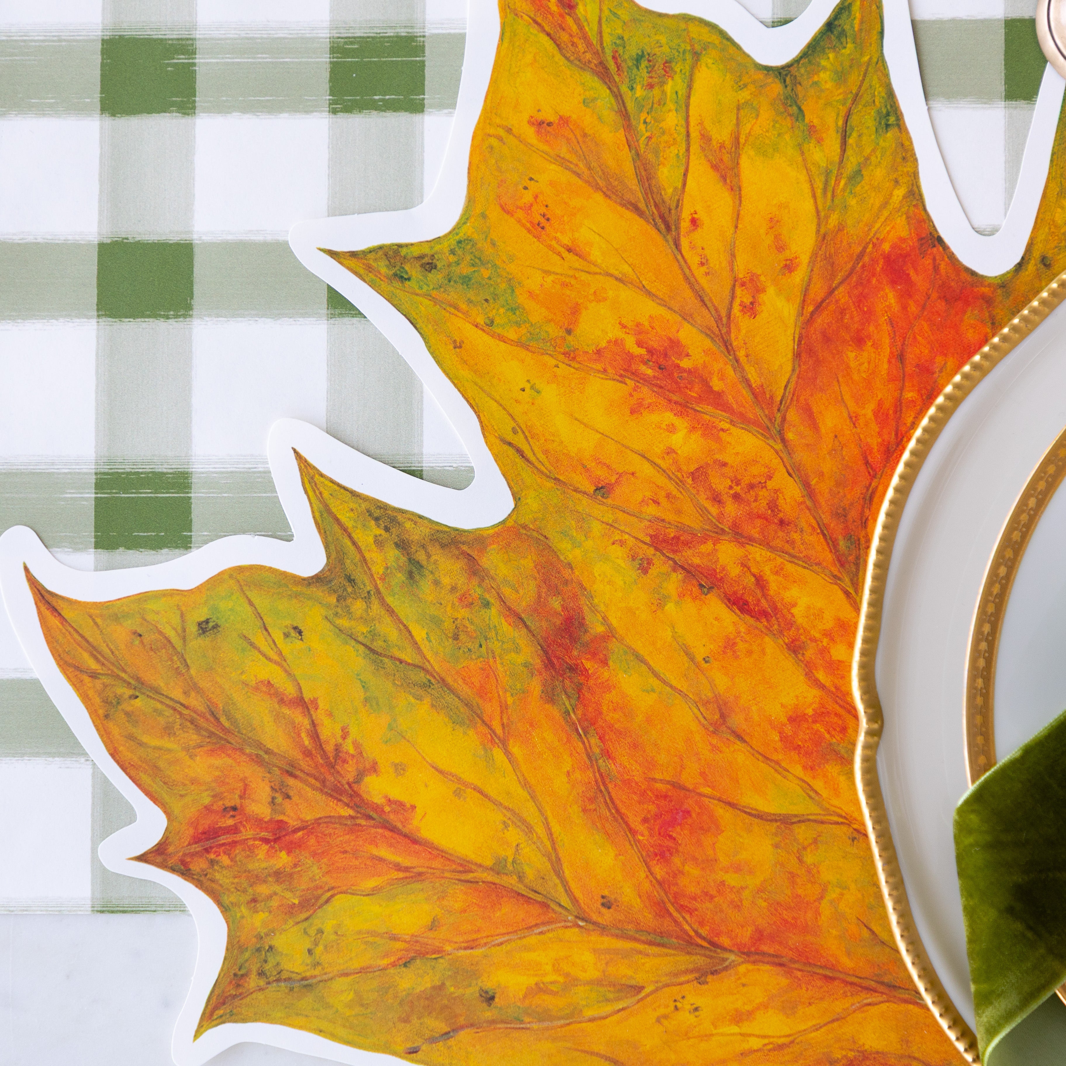 An elegant place setting featuring the Die-cut Fall Leaf Placemat on the Green Painted Check Runner.