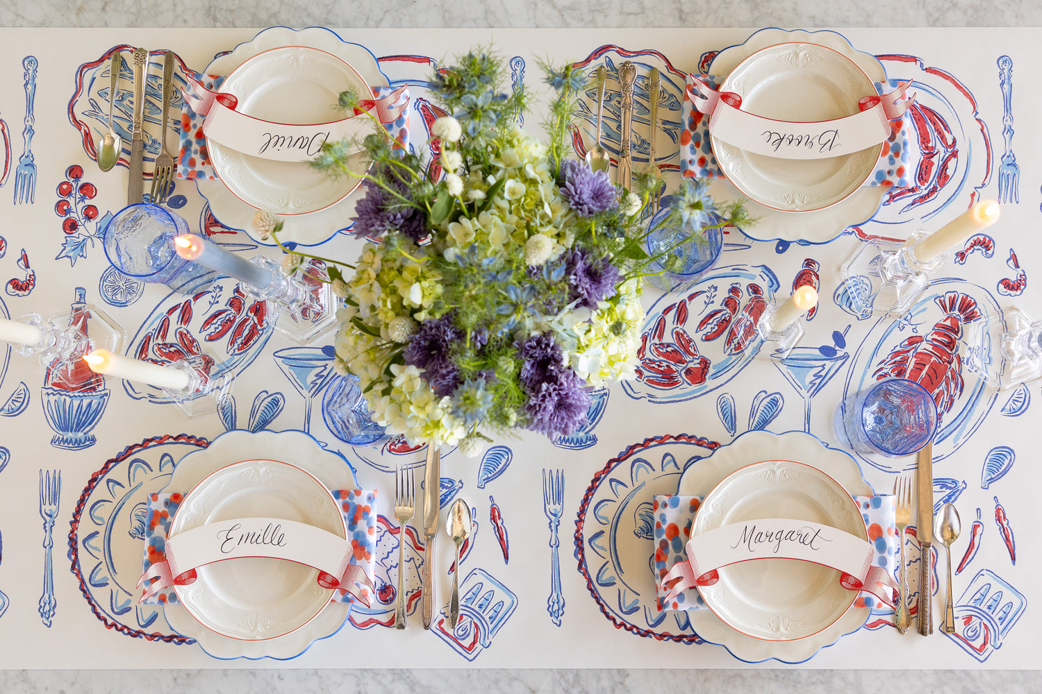 Decorative table setting with place cards and floral centerpiece.