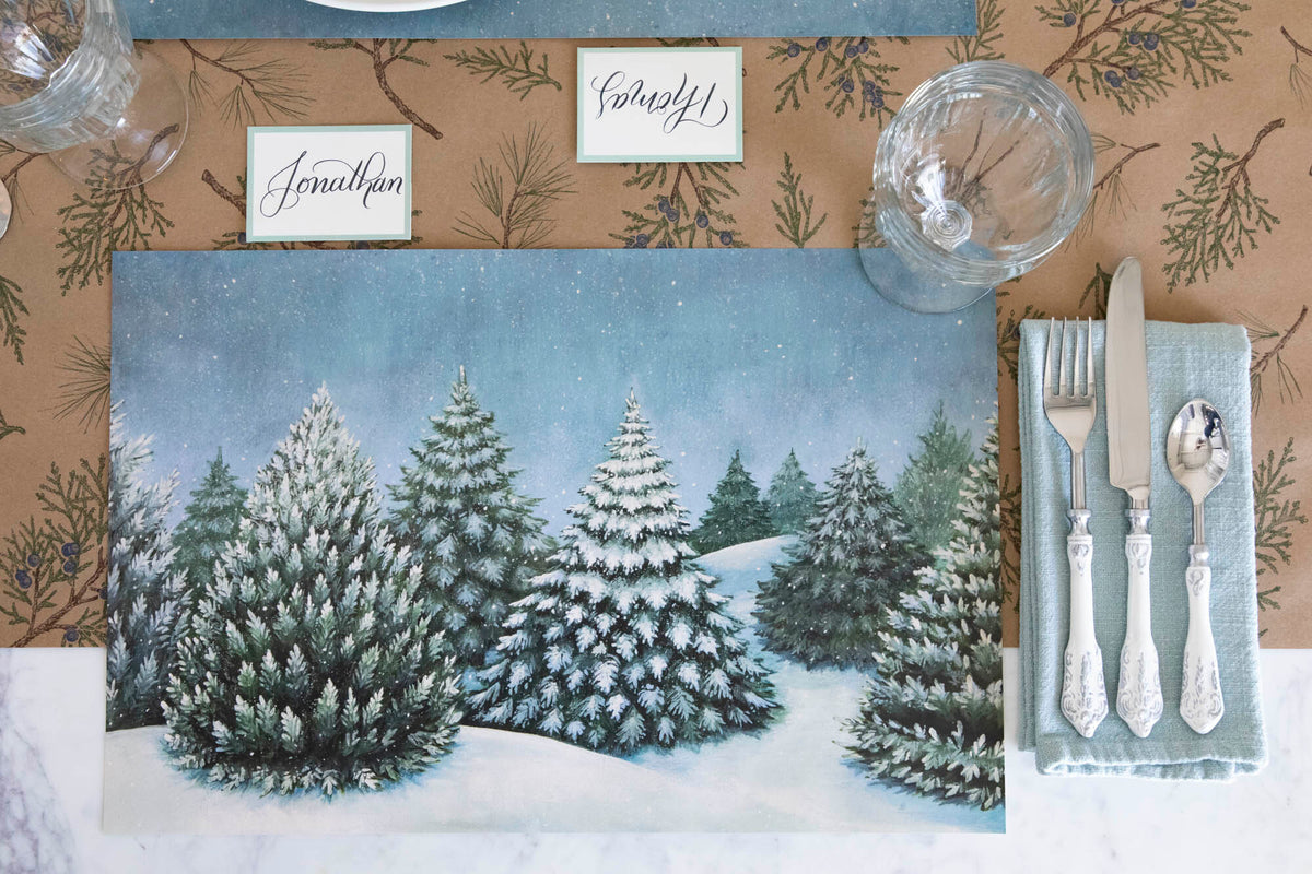 The Evergreen Forest Placemat on a holiday table setting, from above.