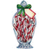 A die-cut illustration of a festive bow-adorned glass jar full of candy canes, with a label on it, serves as a charming table accent.