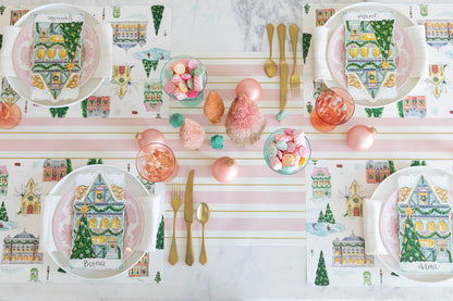 A festive Christmas table setting for four featuring a Townhome Table Accent resting on each plate.