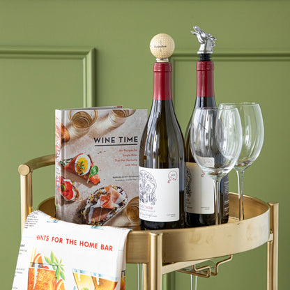 Wine Time book on a bar cart with 2 wine glasses and 2 bottles of wine