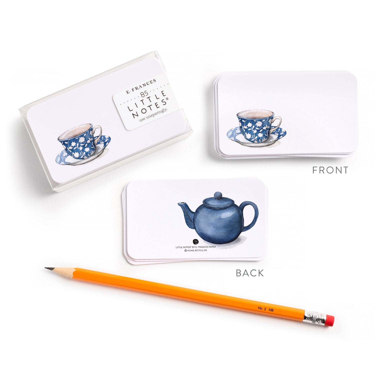 Note cards with teacup designs, a pencil, and a teapot illustration on a white background