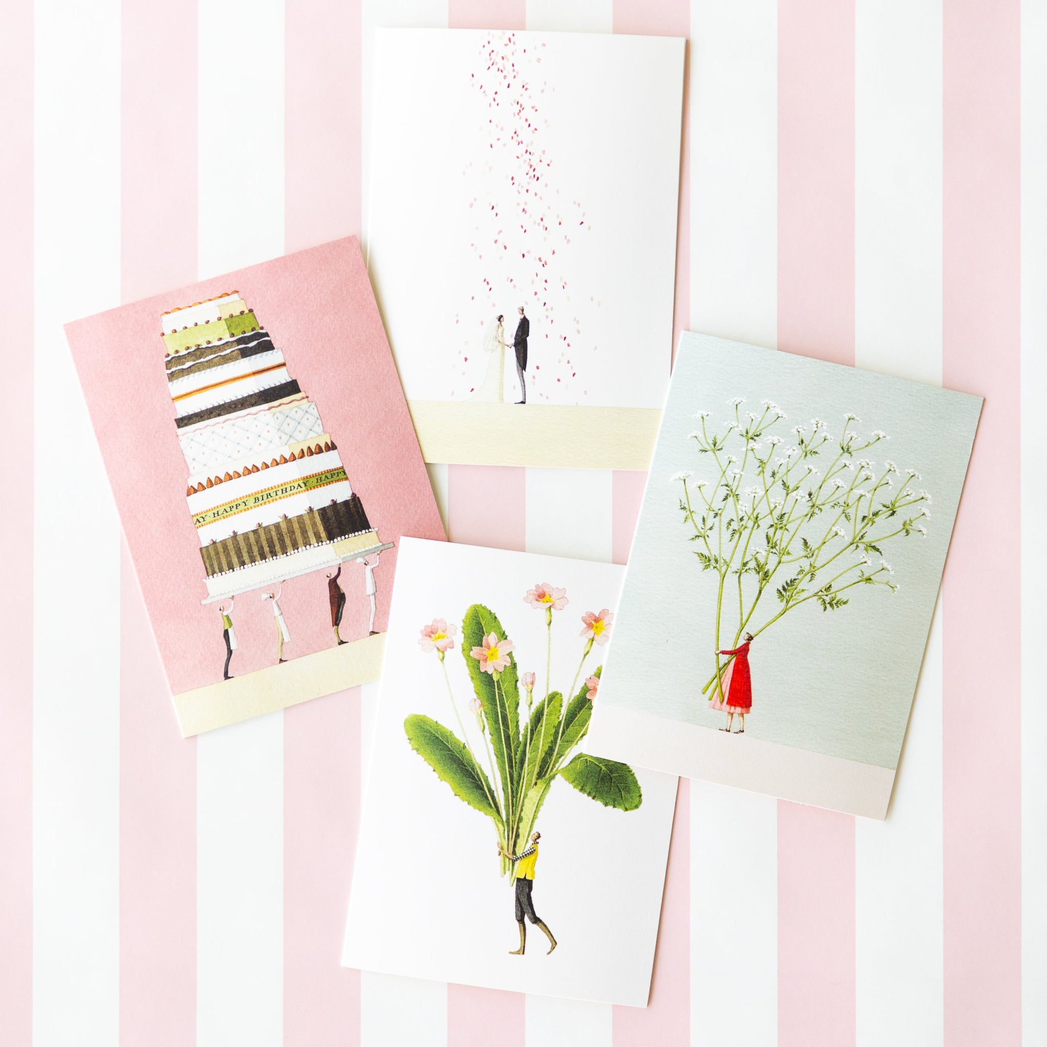 An assortment of four Laura Stoddart cards arranged on a table on the Pink Classic Stripe Runner.