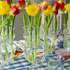 A group of Tulipiere Vases by HomArt on a table.