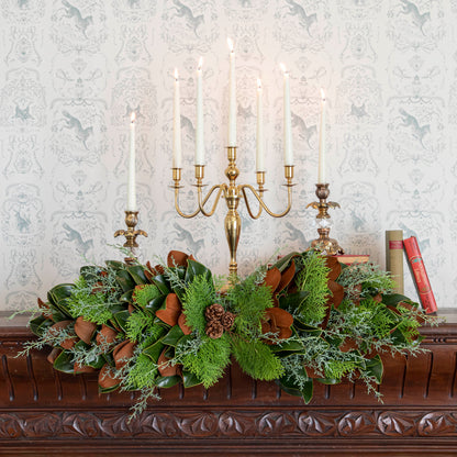 fresh bunches centerpiece styled on a mantle with candles 