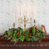 fresh bunches centerpiece styled on a mantle with candles 