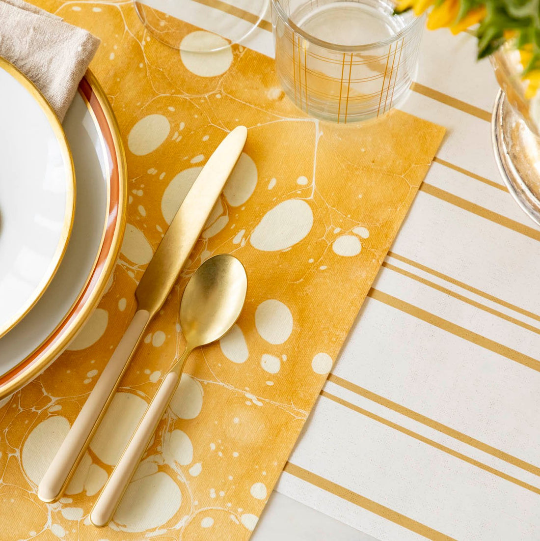 Elegant table setting with the Gold Stone Marble Placemat on the Antique Gold Stripe Runner.