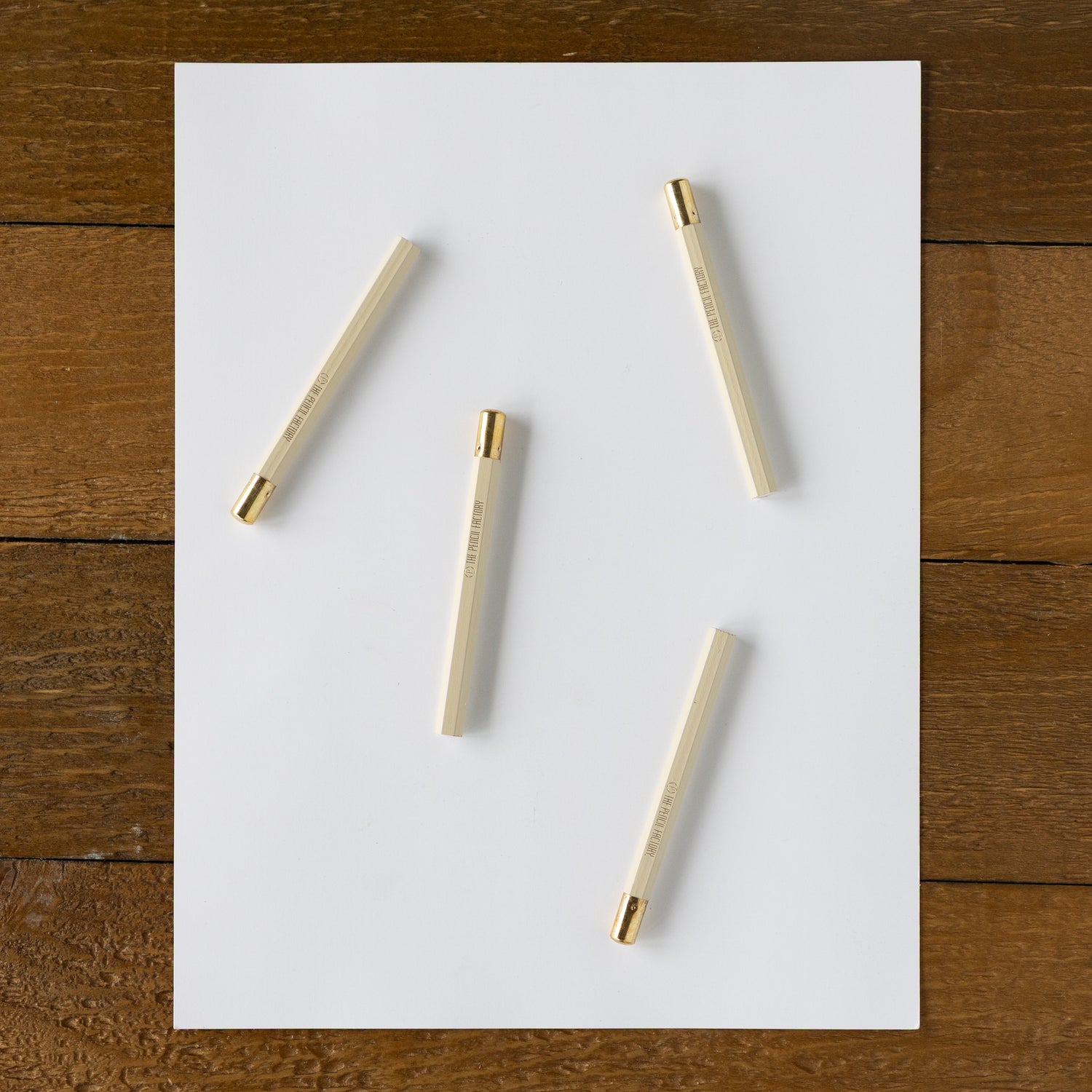 Four Mini Chalkboard Round Golf Pencil on a piece of paper. 