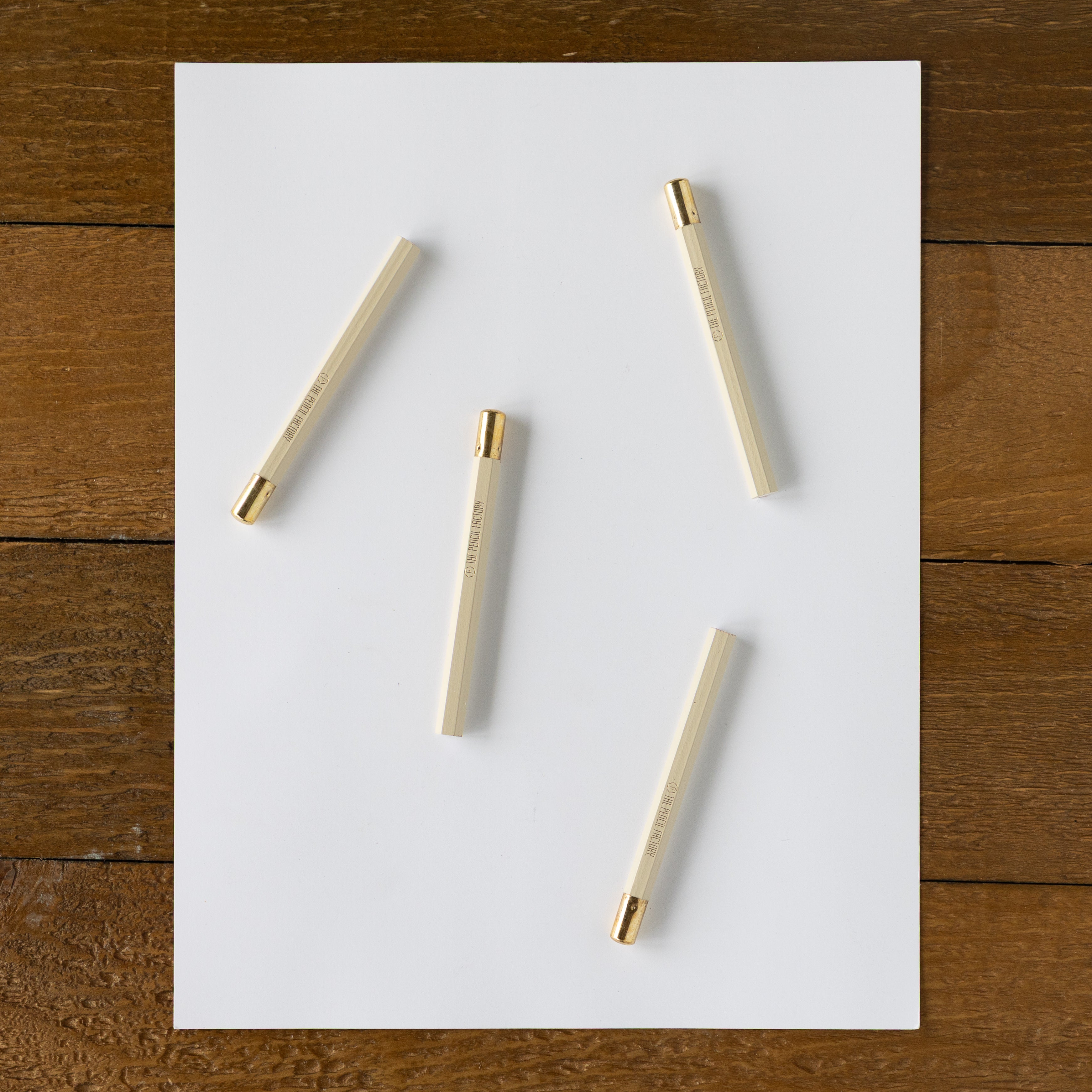 Four Mini Chalkboard Round Golf Pencil on a piece of paper. 