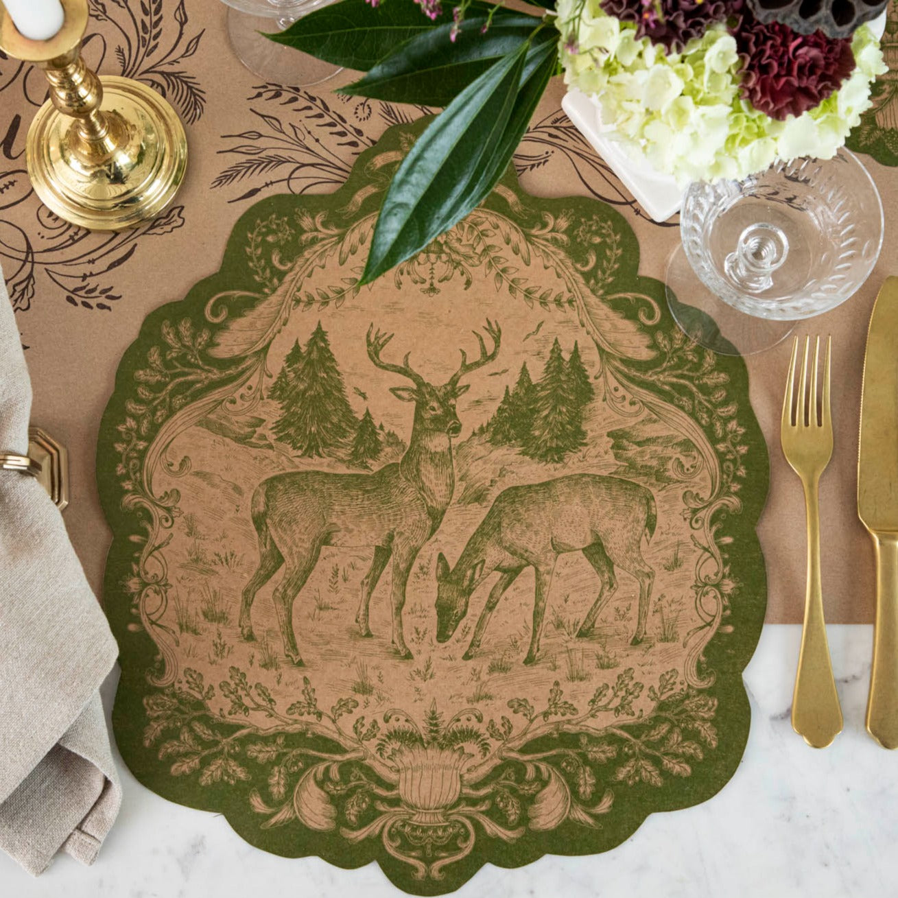 The Die-cut Moss Fable Fauna Placemat on an elegant table setting, from above.