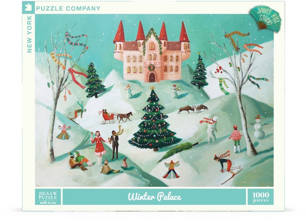 Puzzle box depicting a snowy winter scene with a castle in the background and people frolicking in the snow in the foreground.  Artwork by Janet Hill. 