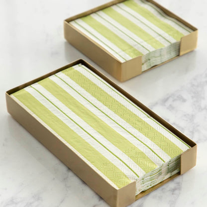 Two sophisticated green striped napkins in a Hester &amp; Cook handmade brass napkin holder.