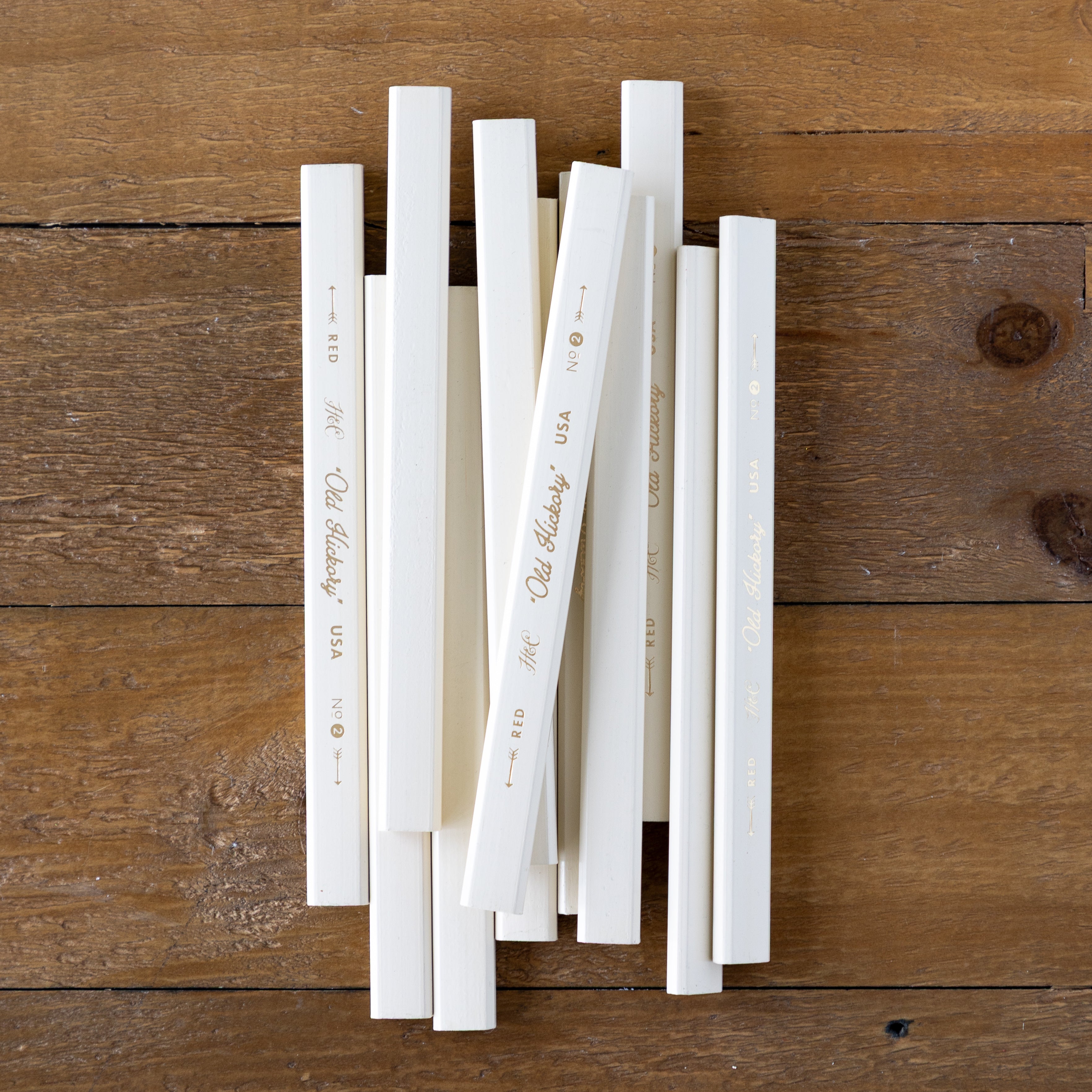 Old Hickory Carpenter Pencils on a wood surface. 