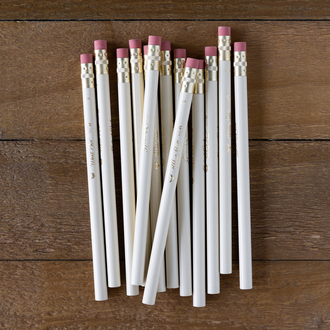 Group of West End Pencils on a wood background. 