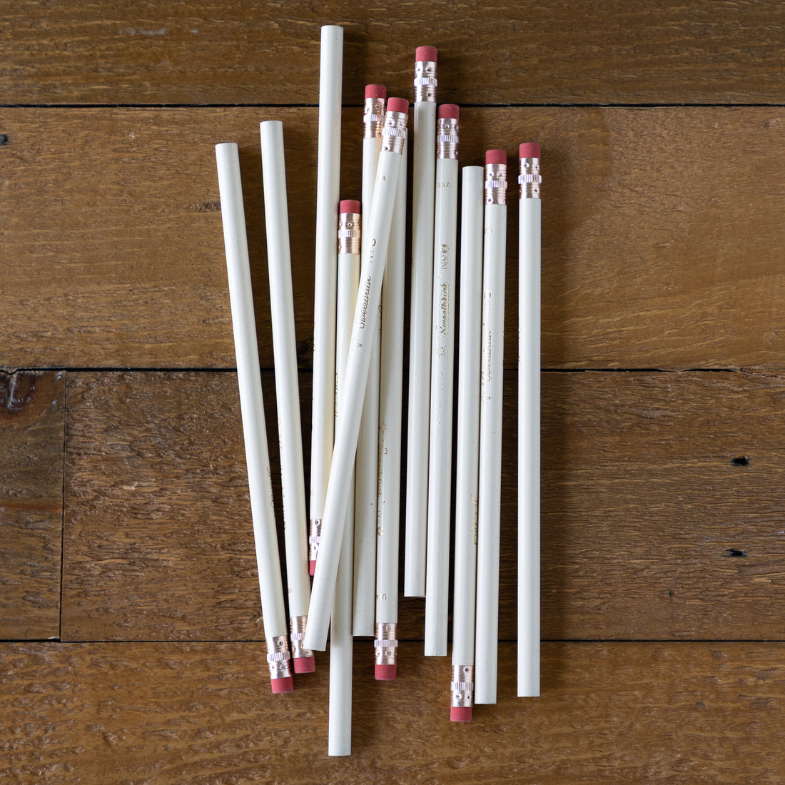 Group of Sweetbriar Pencils on a wood background. 