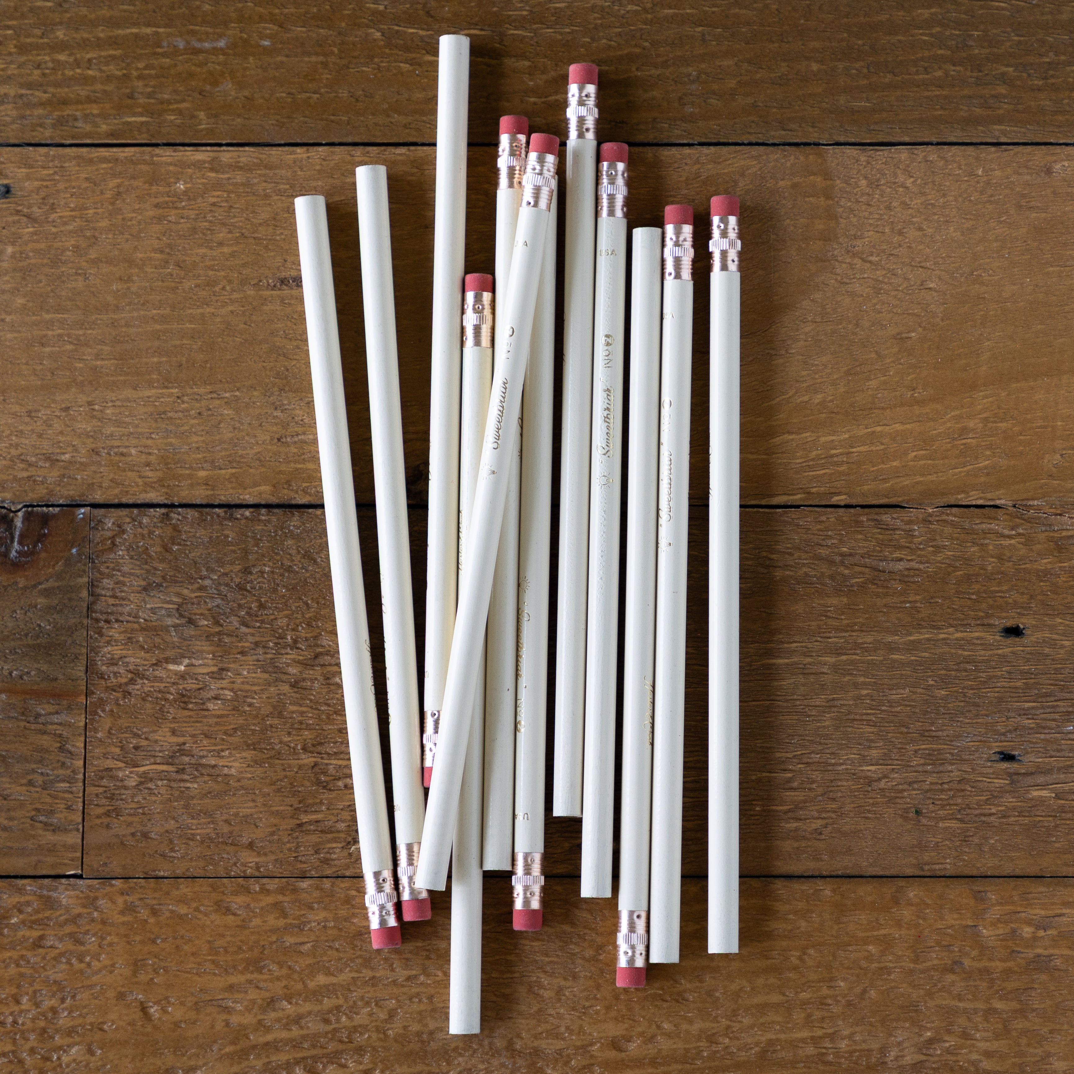 Group of Sweetbriar Pencils on a wood background. 