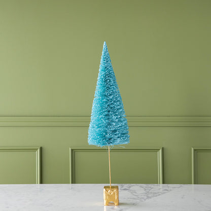 A 26&quot; Cyan French Forest Sisal Tree with a gold base, on a marble table.