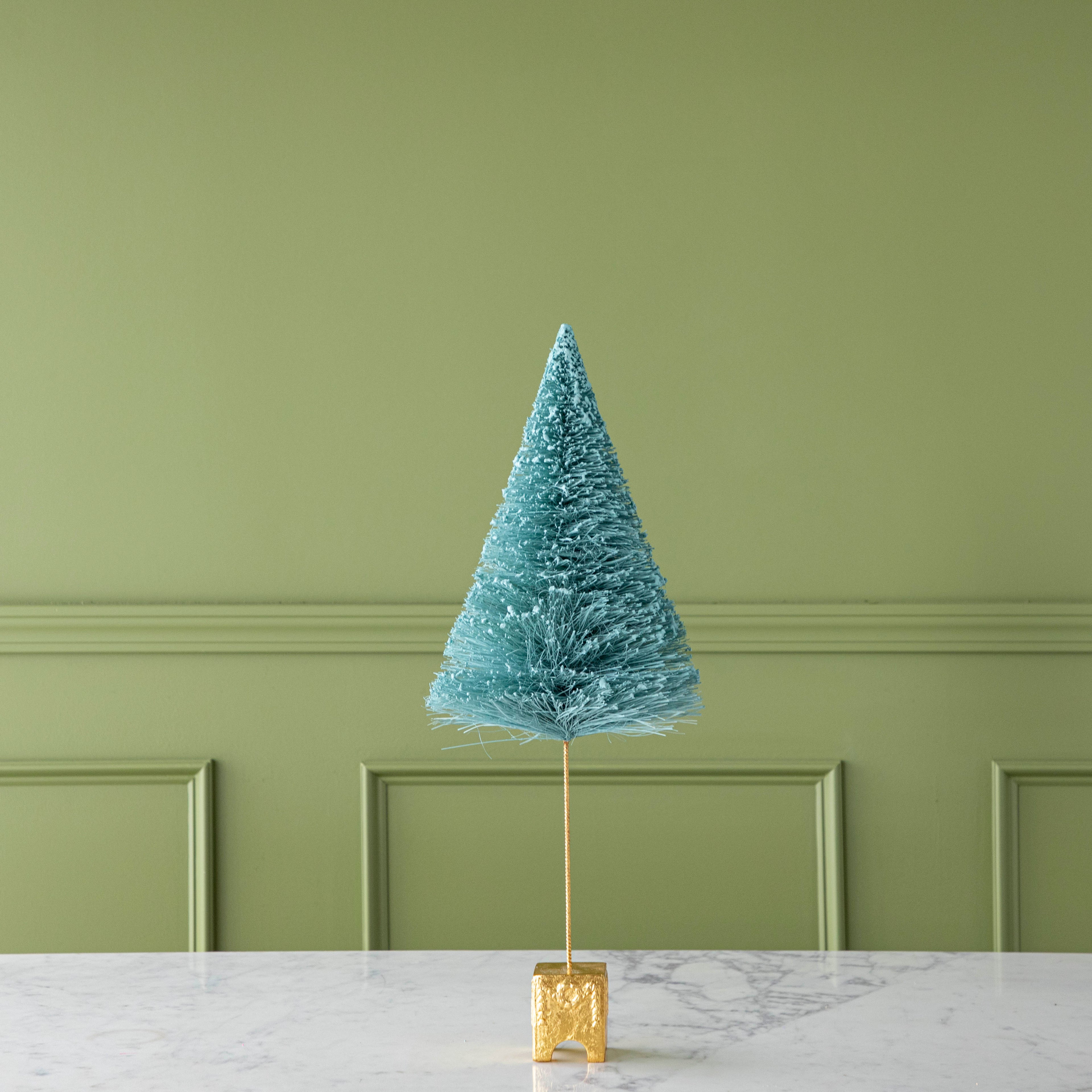 A 22&quot; Mint French Forest Sisal Tree with a gold base, on a marble table.