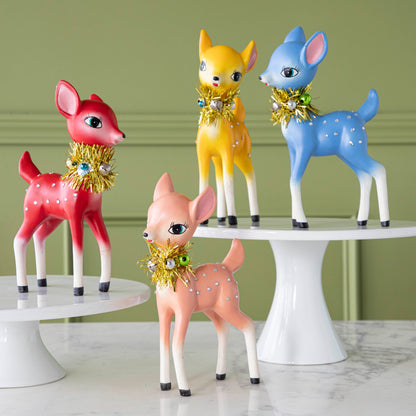 Four, 3&quot; Retro Reindeers in pink, blue, red &amp; yellow, styled on a table with cake stands.