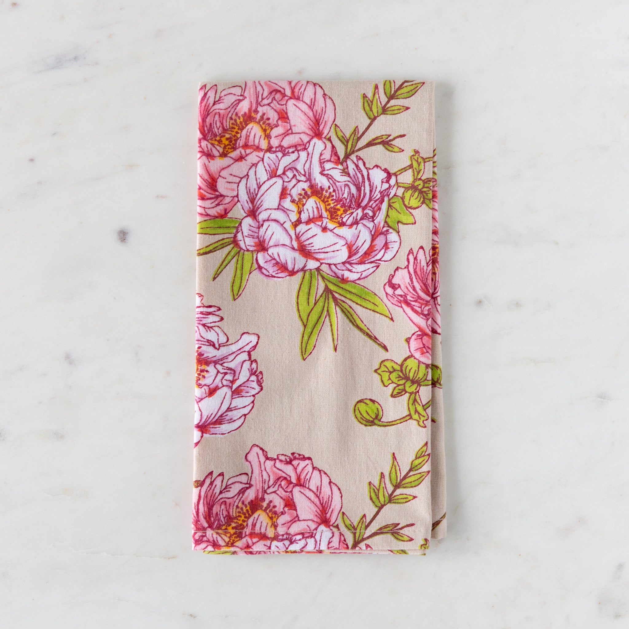 Floral patterned fabric on a white marble background.