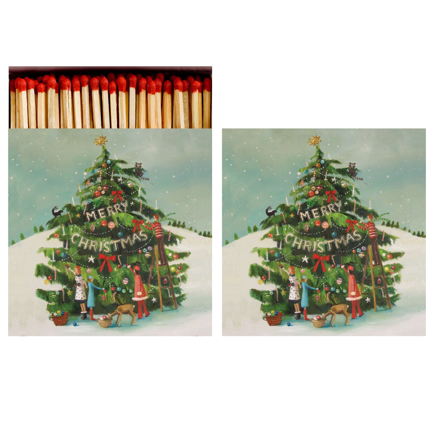 Two identical sides of a square match box, the left of which is open slightly to reveal the matches inside. The artwork depicts a painterly vintage-style illustration of a group of people decorating a large outdoor Christmas tree in a snowy field.