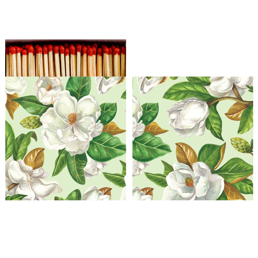 Two sides of a square match box, the left of which is open slightly to reveal the matches inside. The artwork on the box depicts a wall-to-wall pattern of big white magnolia blooms with dark green and brown leaves scattered over the mint green background.