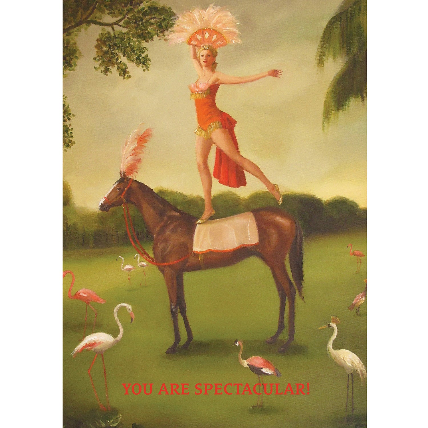 A painterly illustration of a showgirl in a coral costume with a pink feathery headdress balancing on one foot on the back of a brown circus horse dressed to match. The scene takes place on a green lawn with trees in the background, surrounded by pink flamingos. The message &quot;YOU ARE SPECTACULAR!&quot; is printed in red across the bottom of the card. 