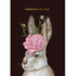 An illustration of a hare adorned with a peony flower and buds below the words "THINKING OF YOU", against a black background.