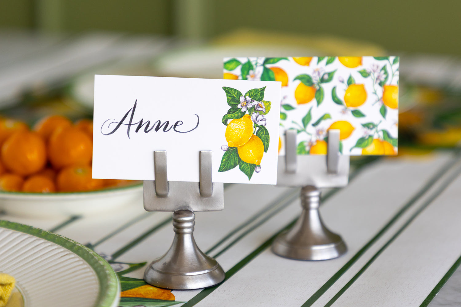 A close-up of a white place card with the name &