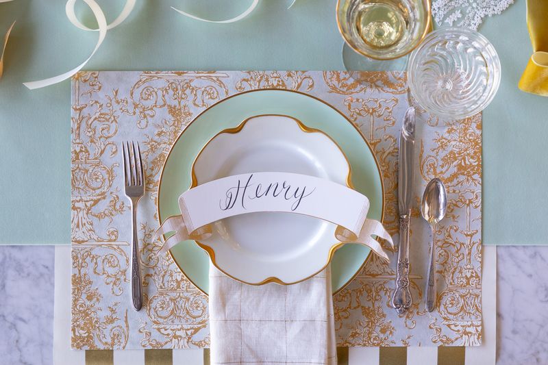 Decorative table setting with a place card labeled &