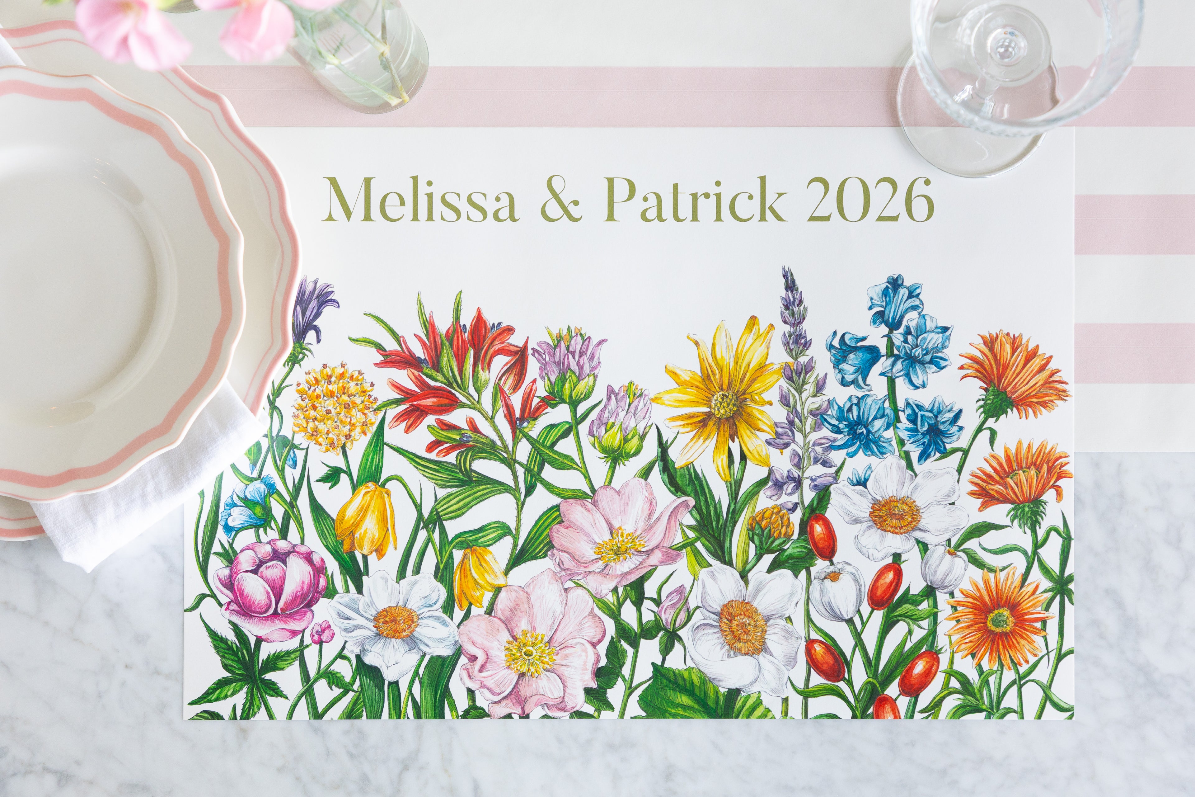 A personalized floral placemat featuring the names &