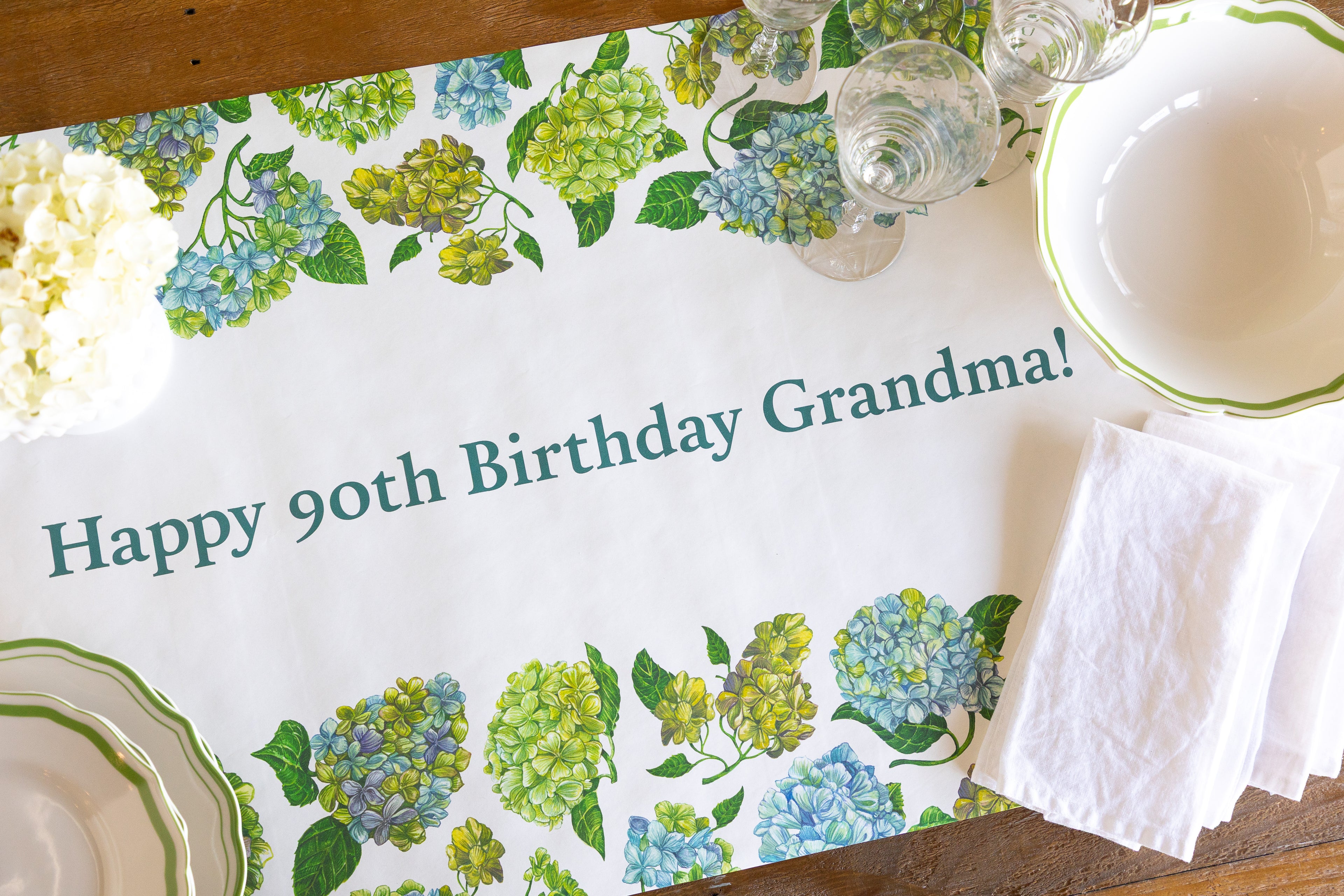 A white table runner with &