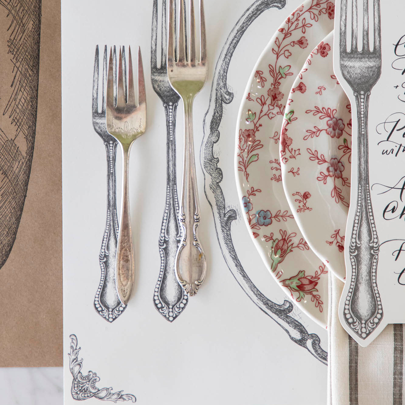 Perfect Setting Placemat with vintage silverware on top and a place setting for one.