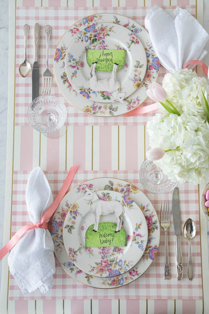 A pink and white table setting with plates and napkins featuring pink Pink Painted Check Placemats by Hester &amp; Cook.
