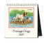 A desk calendar featuring vintage dog artwork. 