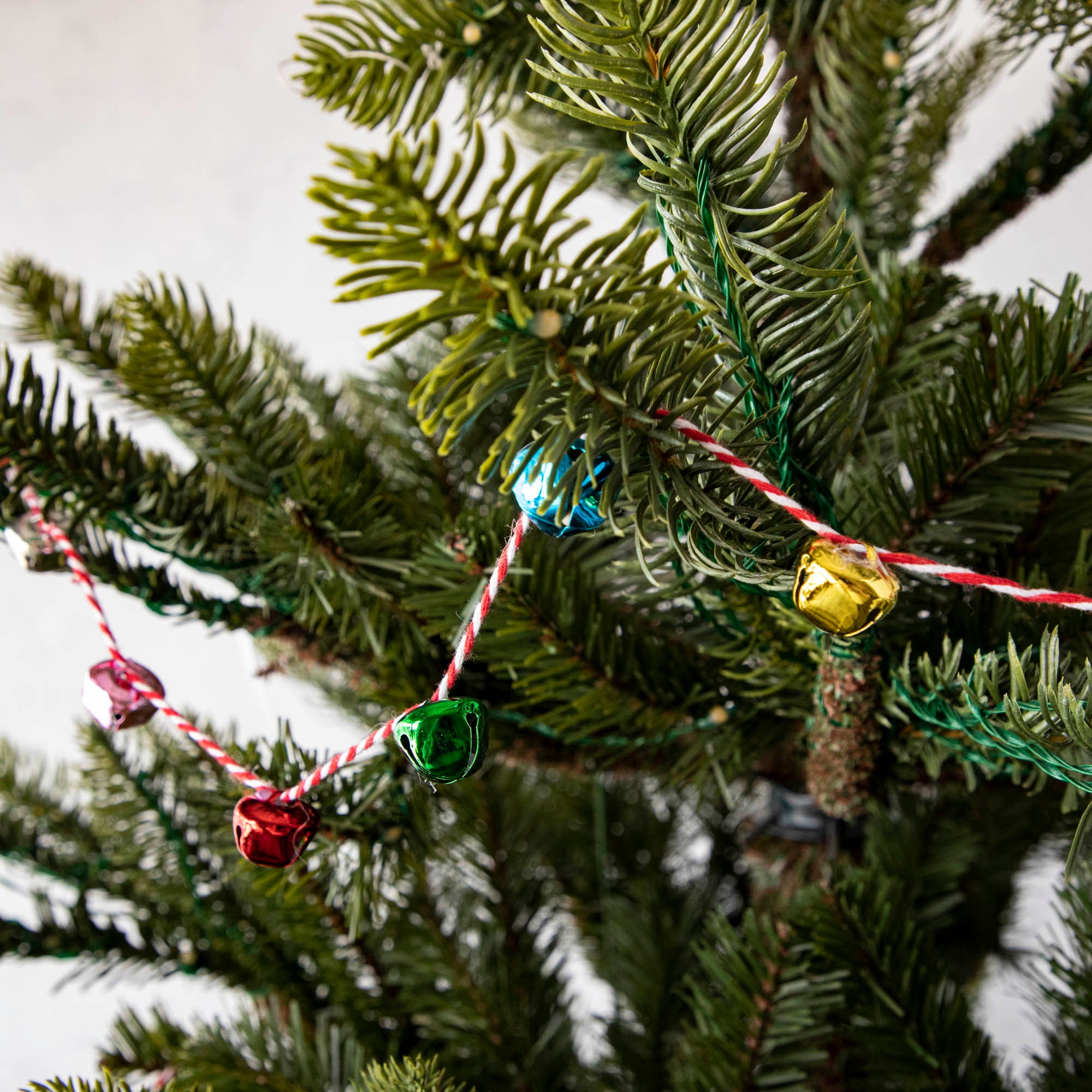 The Vintage Bell Garland draped on a tree.