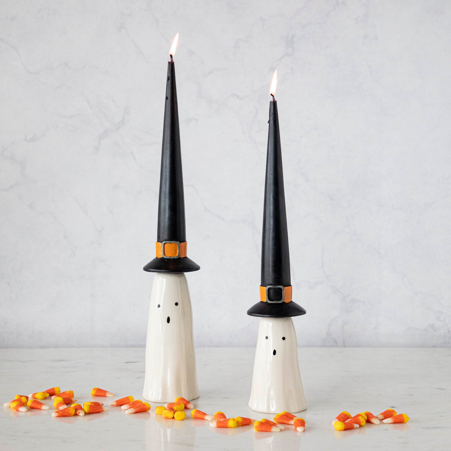 Three Phantom Candleholders from Accent Decor with candy canes on them.