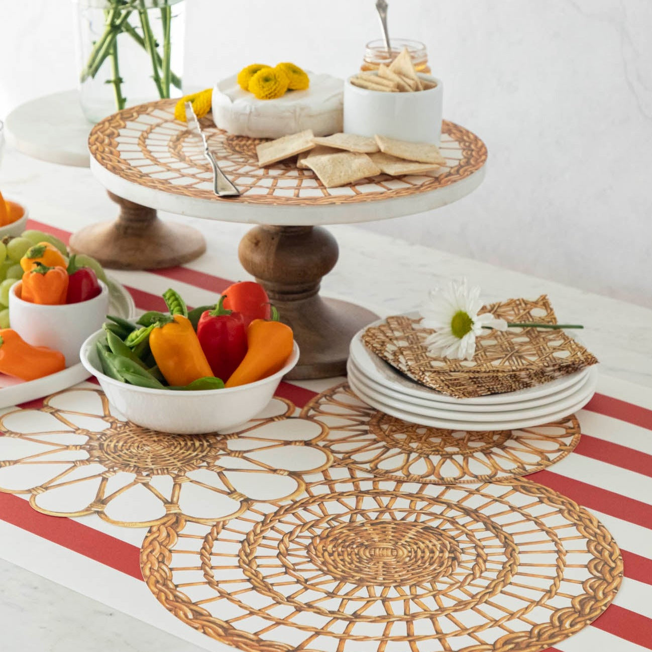 A vintage-inspired table with plates and bowls of food on it, featuring Hester &amp; Cook&
