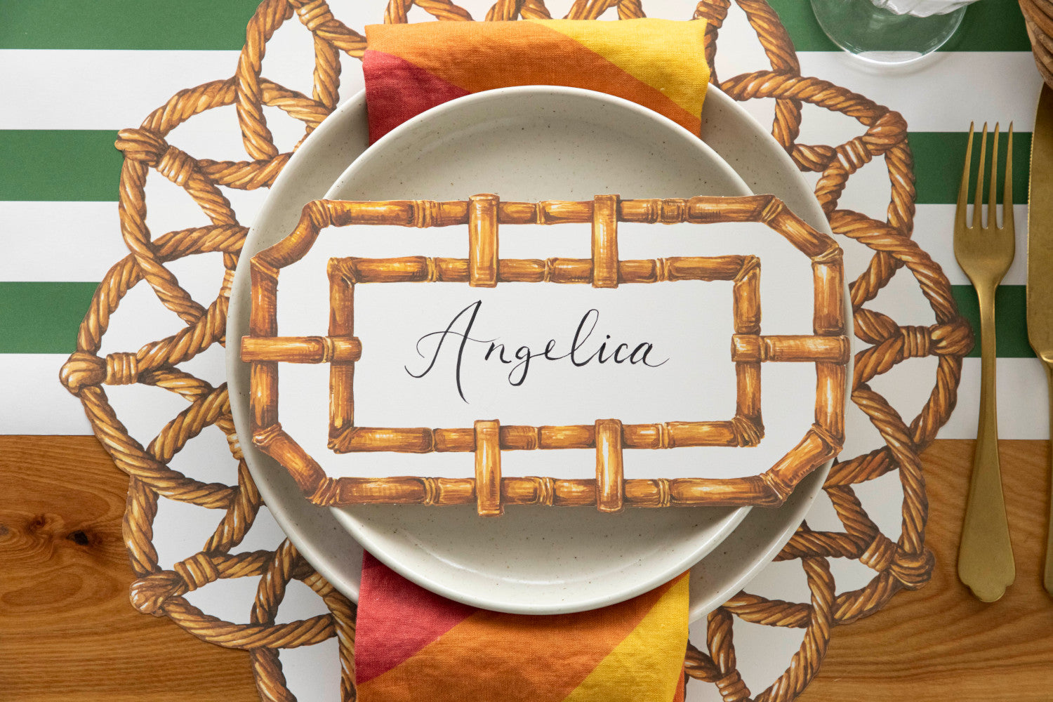 A Die-cut Rattan Weave Placemat with a Hester &amp; Cook name tag on it.