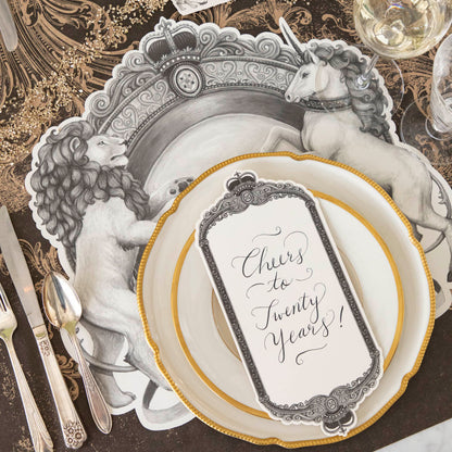 Regal Frame Table Card with &quot;Cheers to Twenty Years!&quot; written on it, resting on dinner plates on a regal table setting for one.