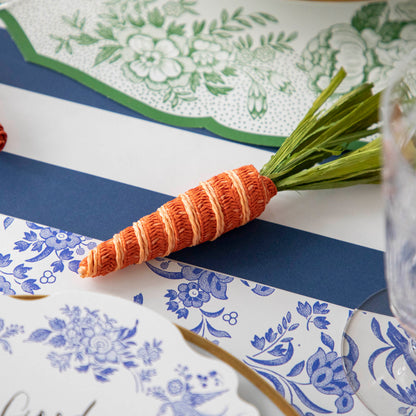 A table setting with a Glitterville Natural Carrot on it.