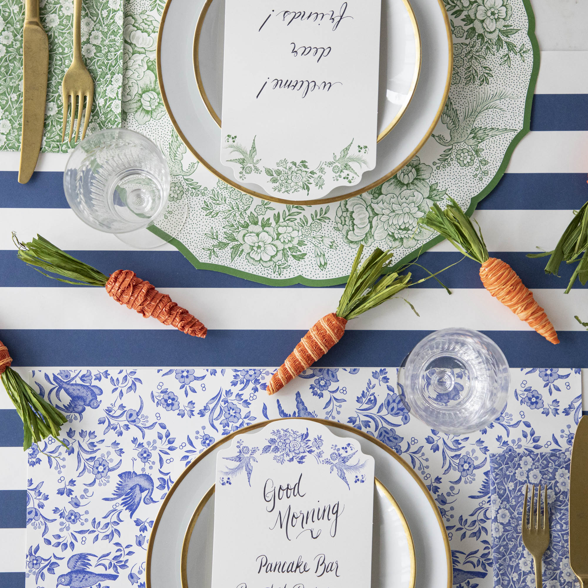 A table setting adorned with blue and white colors, complete with place settings and Glitterville&