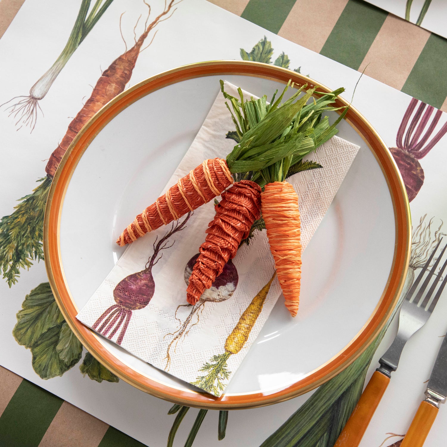 A plate with Glitterville Natural Carrots and a fork on it, perfect for a table setting or Easter baskets.