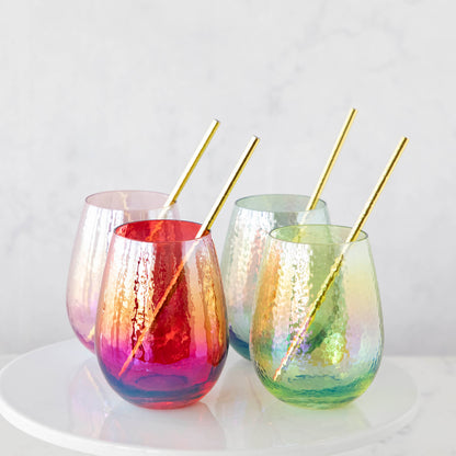 Four Luster Stemless Glasses with gold straws on a white plate, perfect for home drinks. (Zodax)